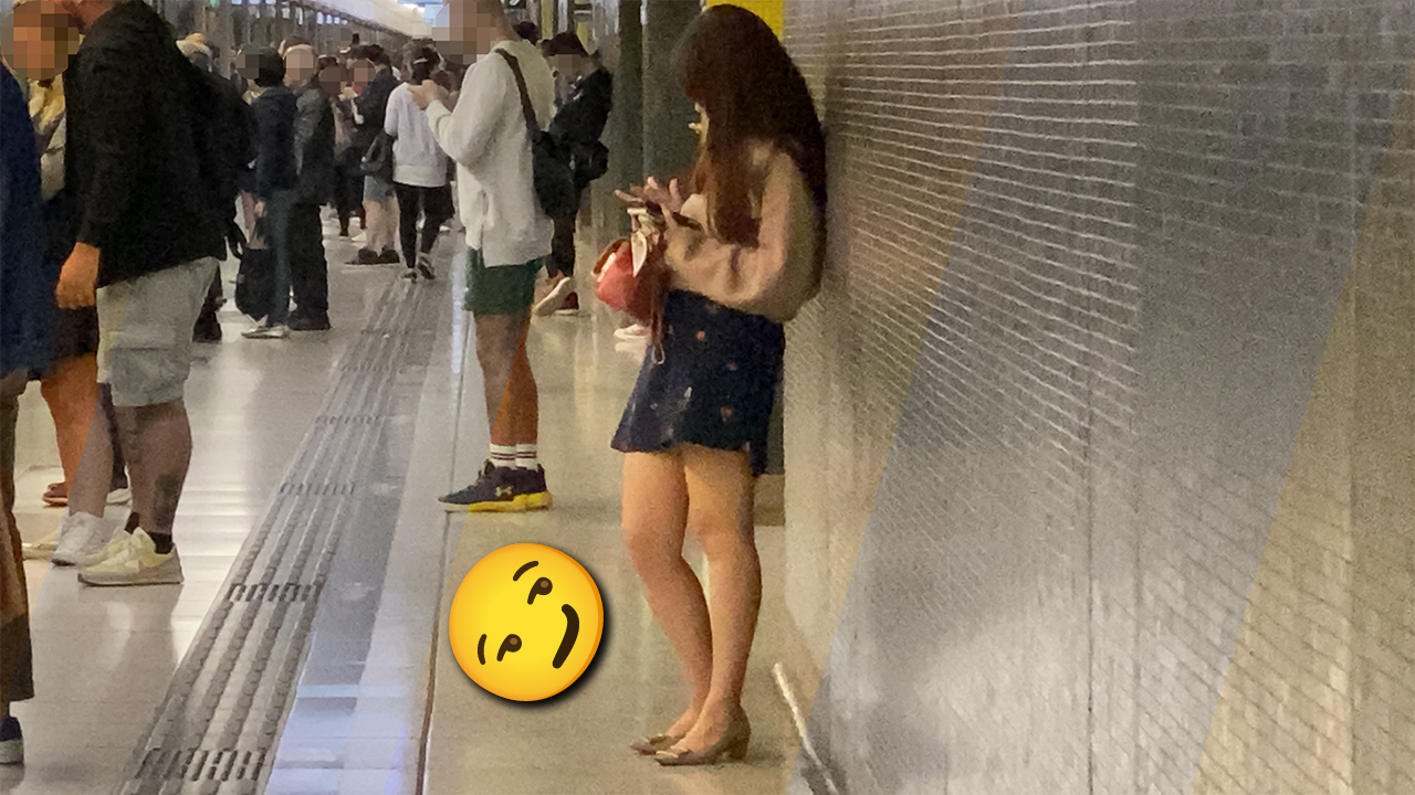 Cute girl texting at Hong Kong MRT