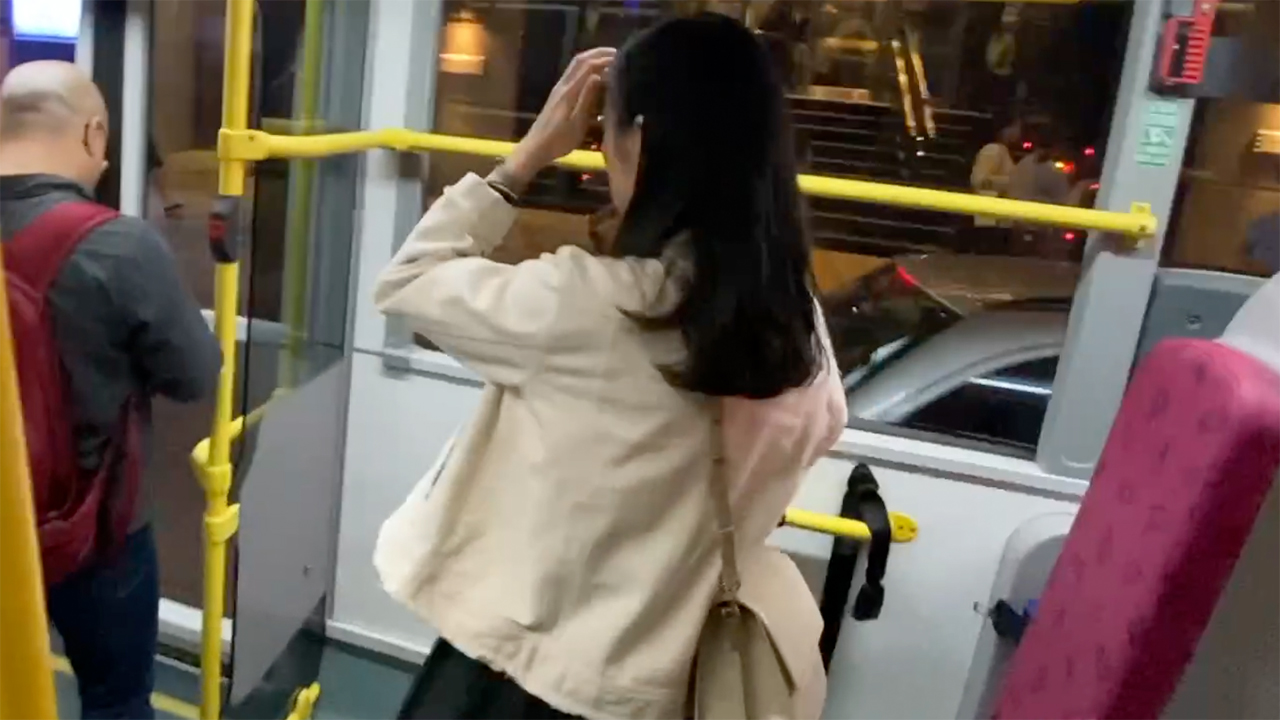 Girl getting off Hong Kong Bus Ride
