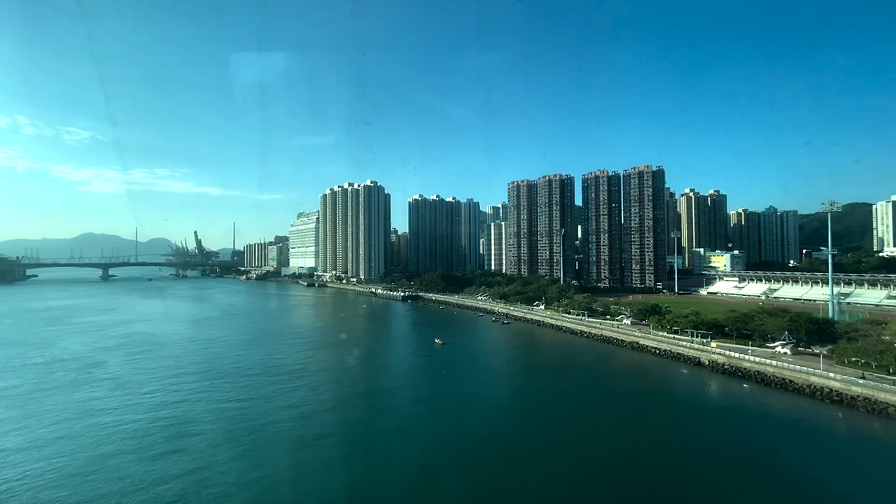 Hong Kong Water View with buildings and bridge in background