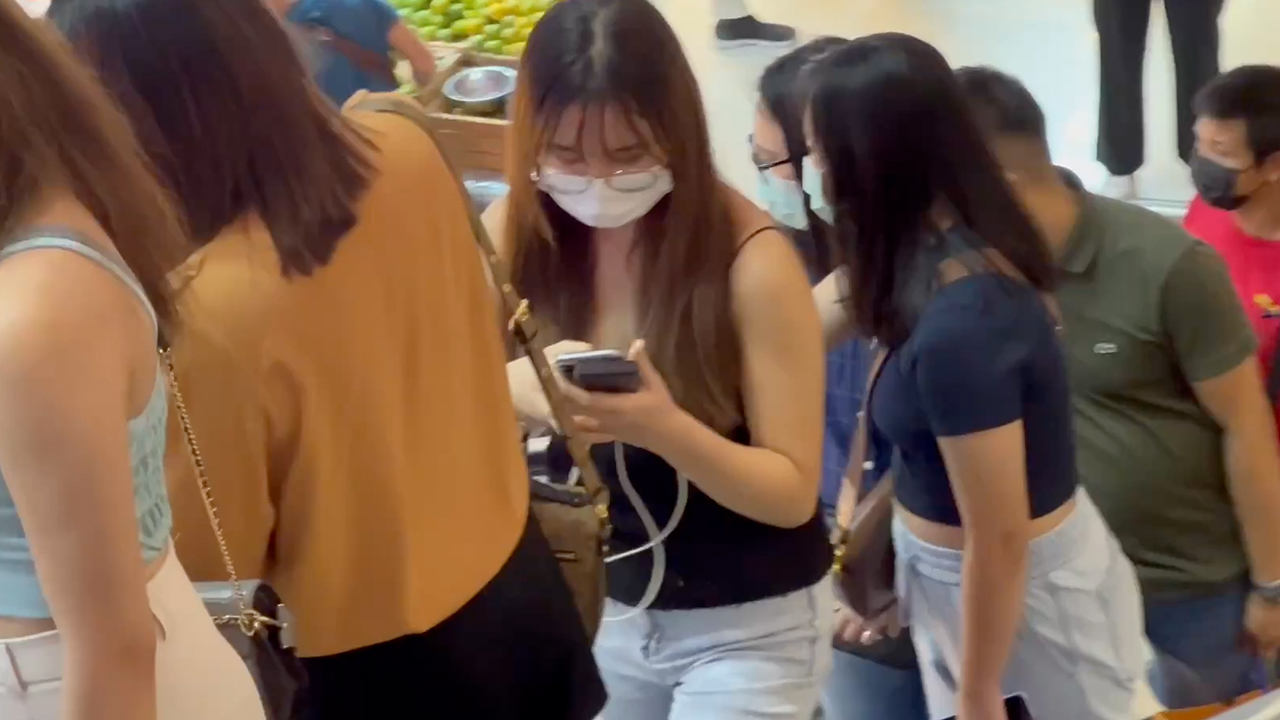 Average Thai Girl in glasses and mask texting