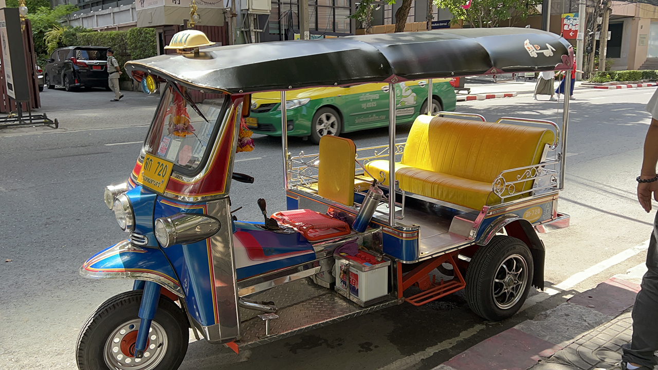 Thai Tuktuk parked on side of the road in Bangkok