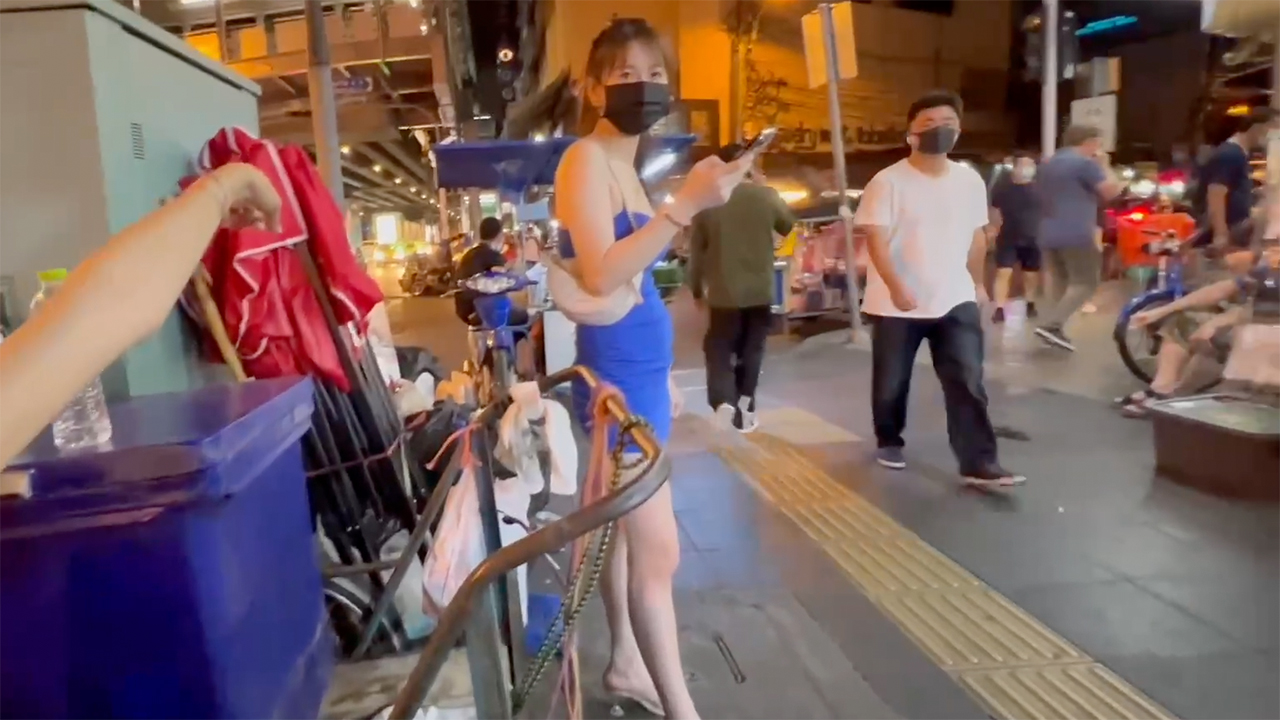 Thai Slender Slut on phone staring at me in the streets