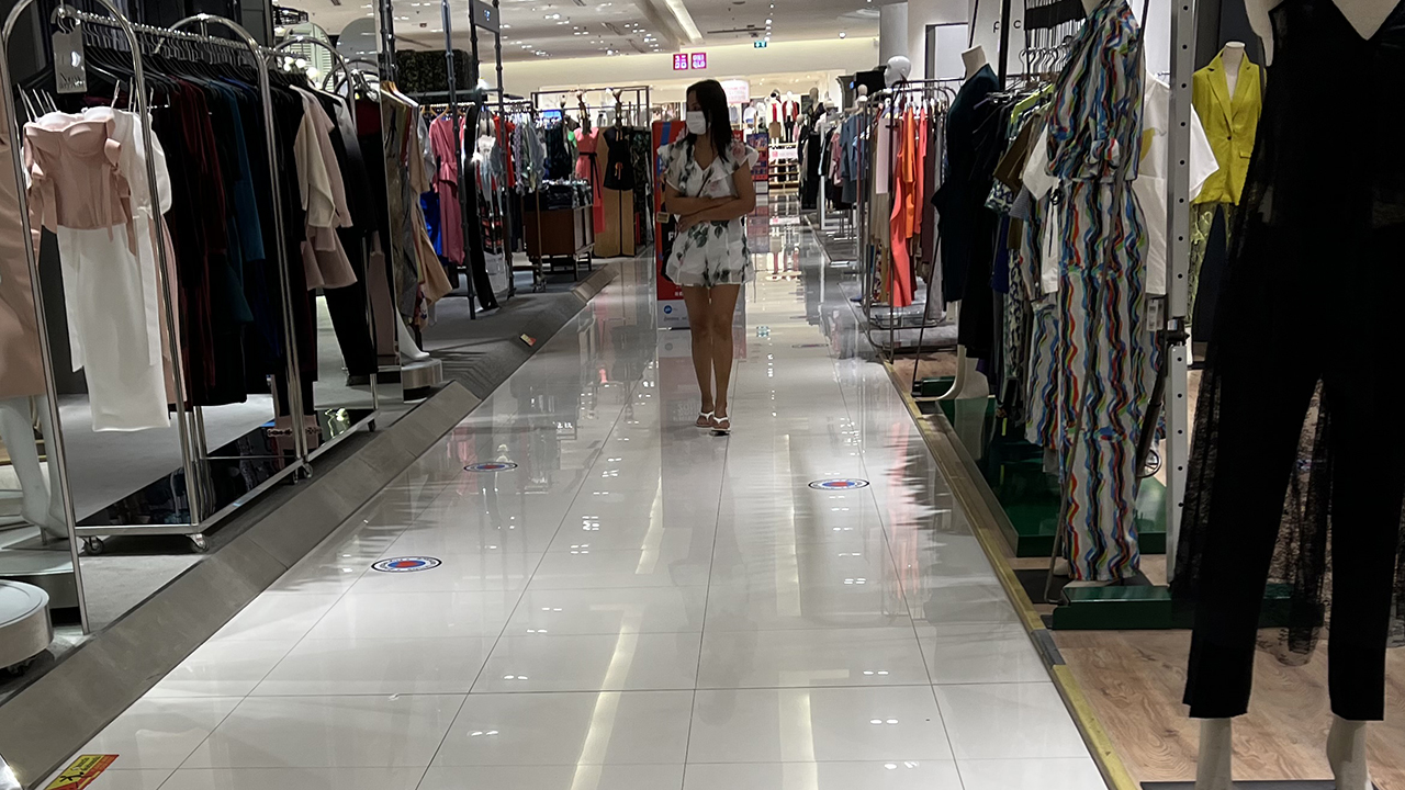 Hot girl walking the aisle at a clothing store in the Siam Paragon mall