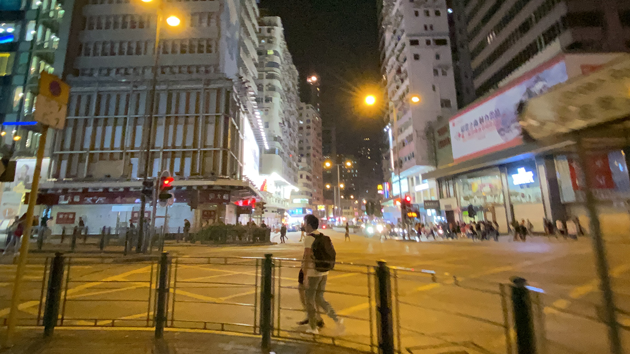 People out walking at night for some Hong Kong Food