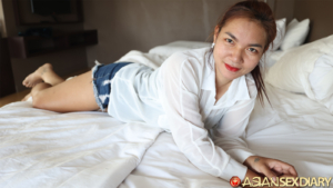 Jeans factory worker poses seductively on bed