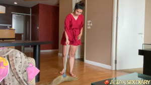 Cute girl cleaning my apartment with broom