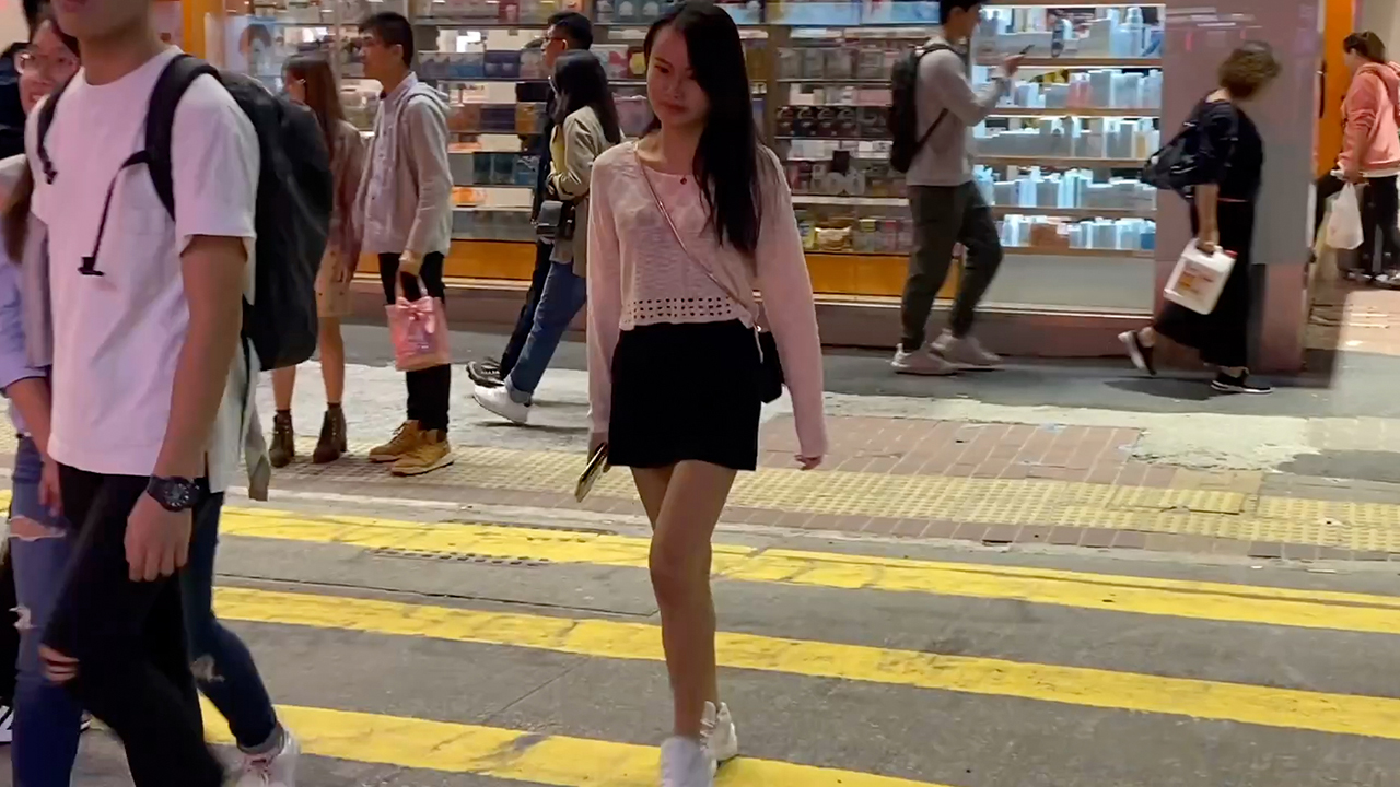 Cute Asian Girl In The Street wearing short skirt