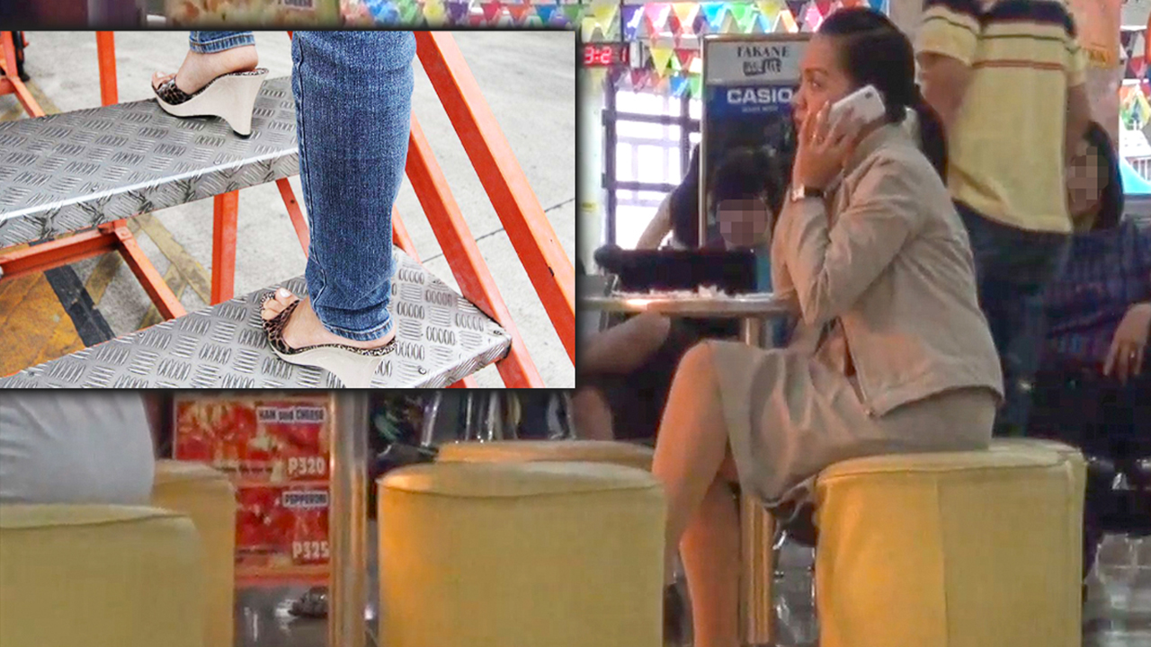 Asian Sexy Feet in heels and jeans overtop business woman in airport image