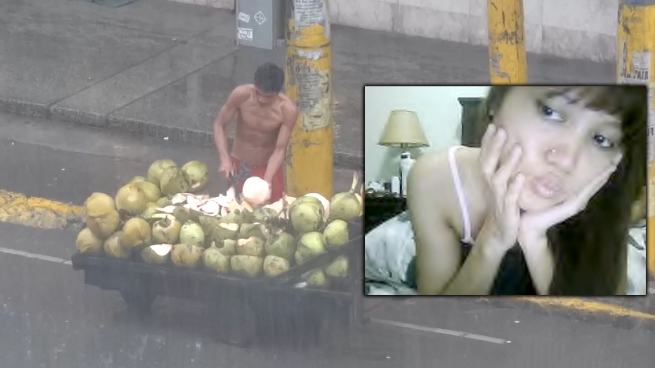 Cebu City Street Vendor cutting fruit in rain and girl on cam