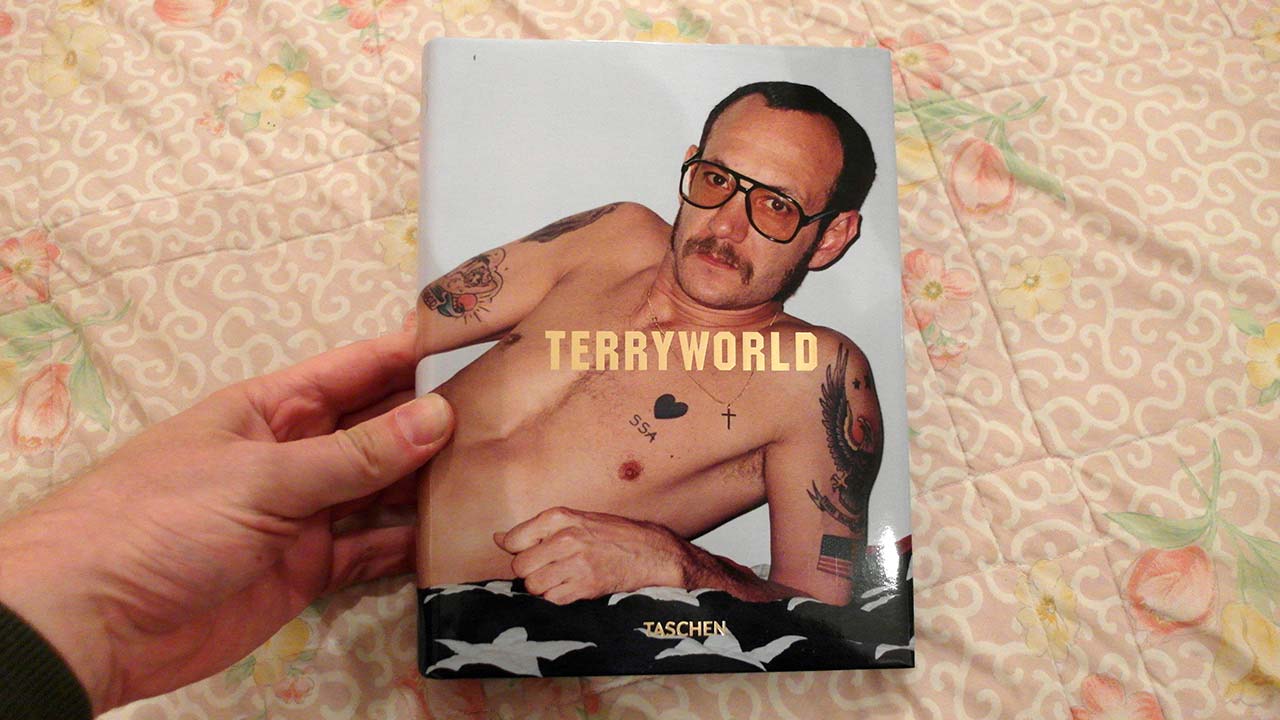 Man holds Terryworld book in his hand