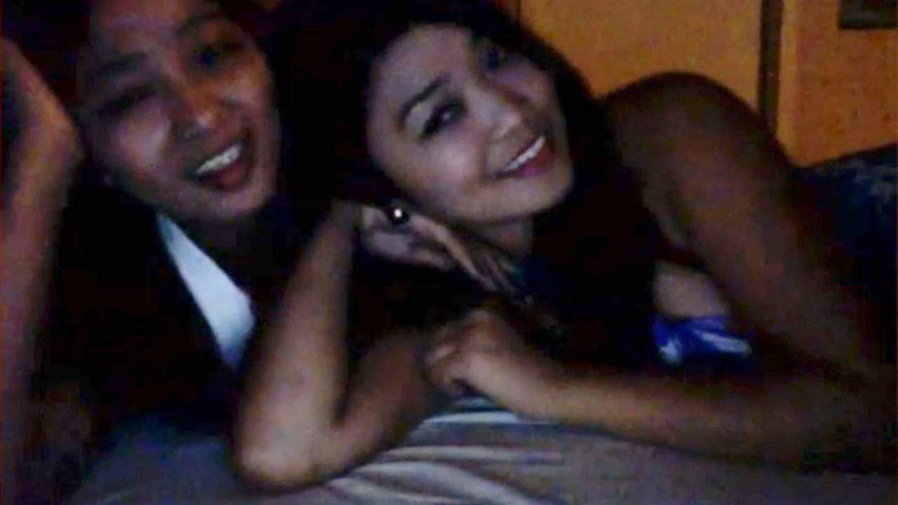 Smiling Filipina Hot Cam girls lay together