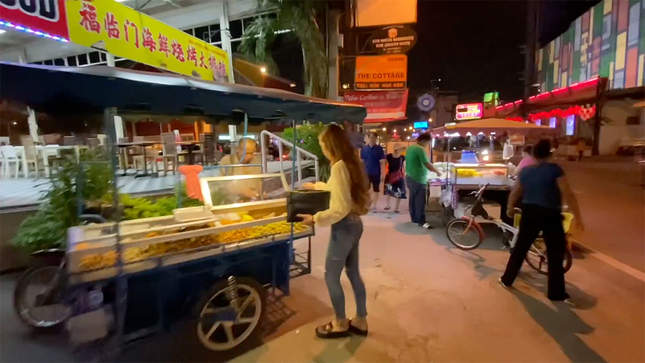 Tight Jeans Asian girl works food cart in Pattaya