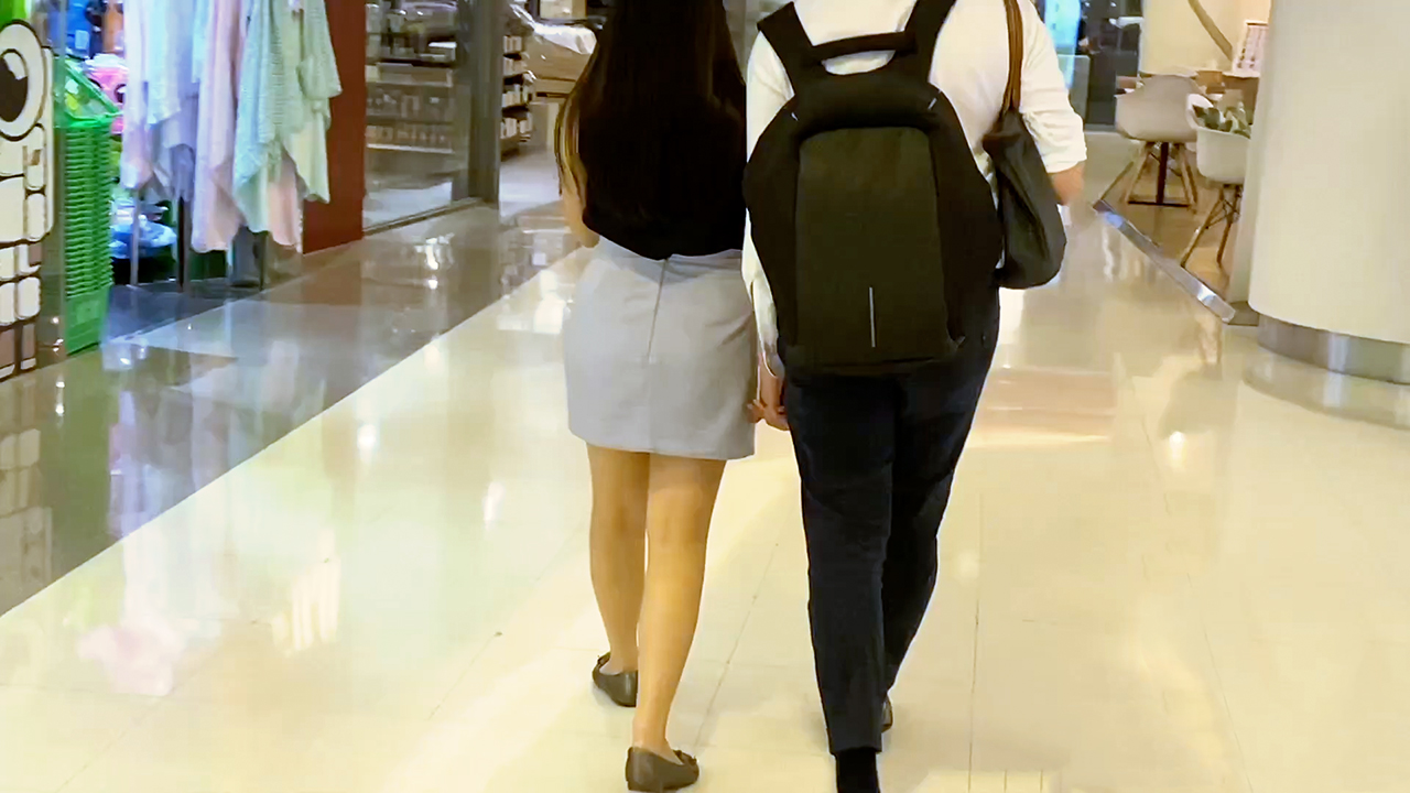 Cute Girl In A Skirt walking with her boyfriend