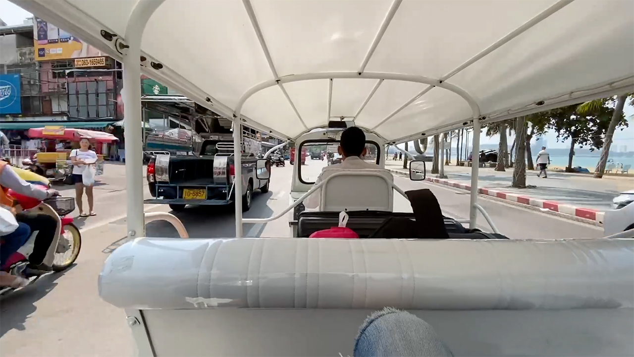 POV view of ride to hospital in Tuktuk Car back seat