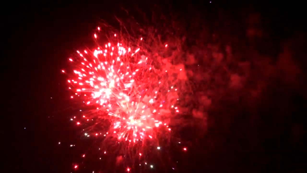 Red Filipino Fireworks explode in the sky