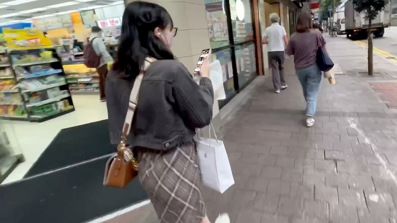City Walk Hong Kong with cute girl on phone