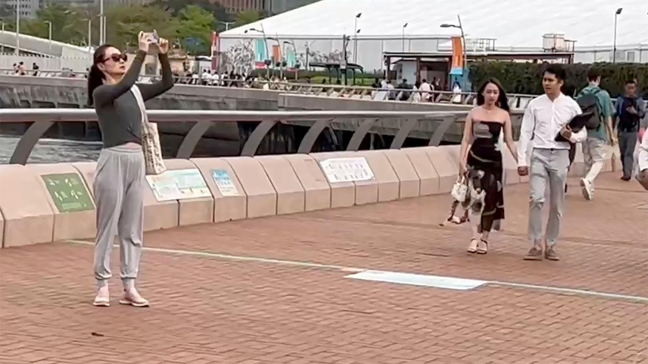 Hot Hong Kong Girls walking and taking pics at Harbour