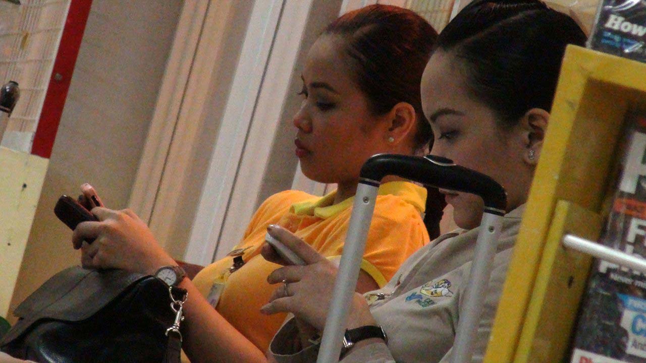 Sexy Flight Attendants texting on their phones