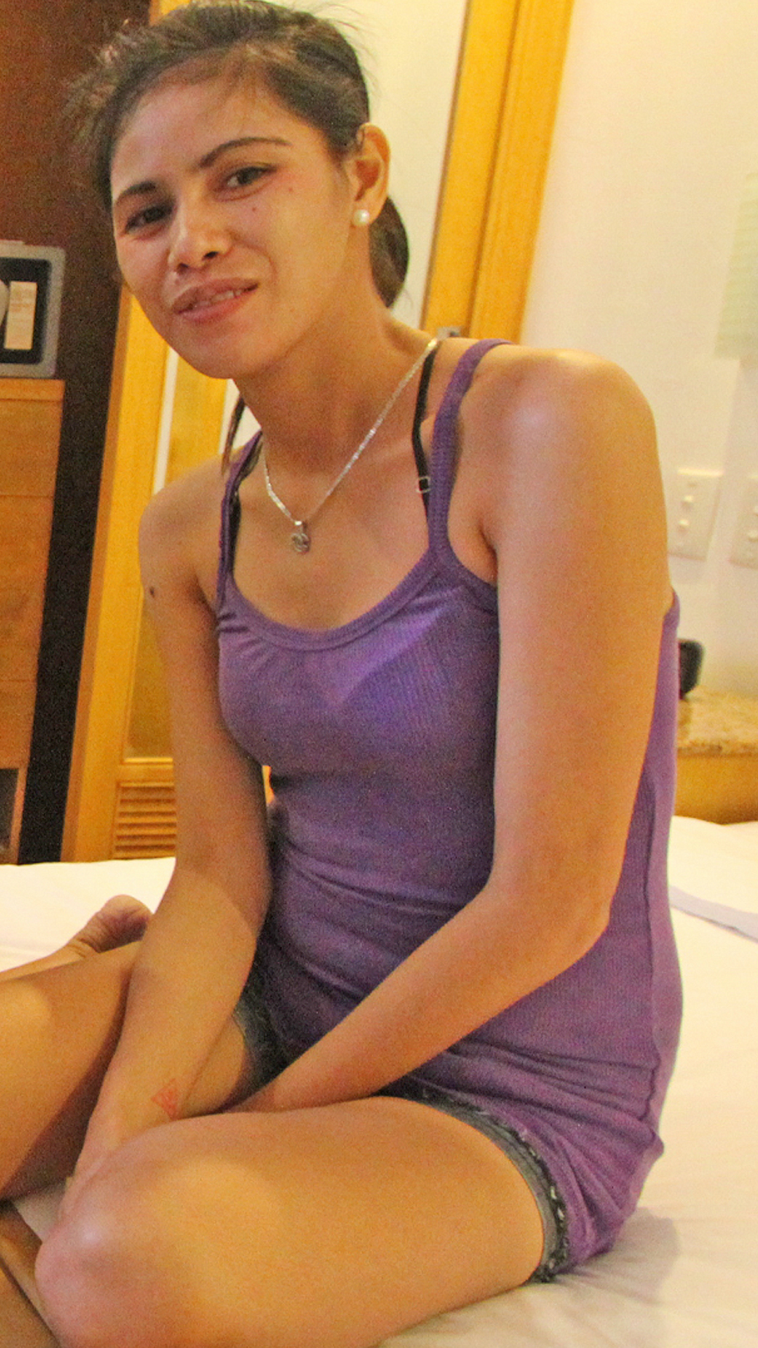 Asian Sex Diary Mercy gets ready to get naked in the hotel room
