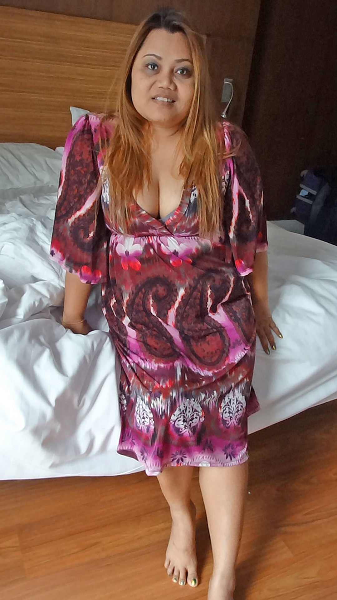 Bbw Asian Sex Diary Nam standing in her dress in the hotel