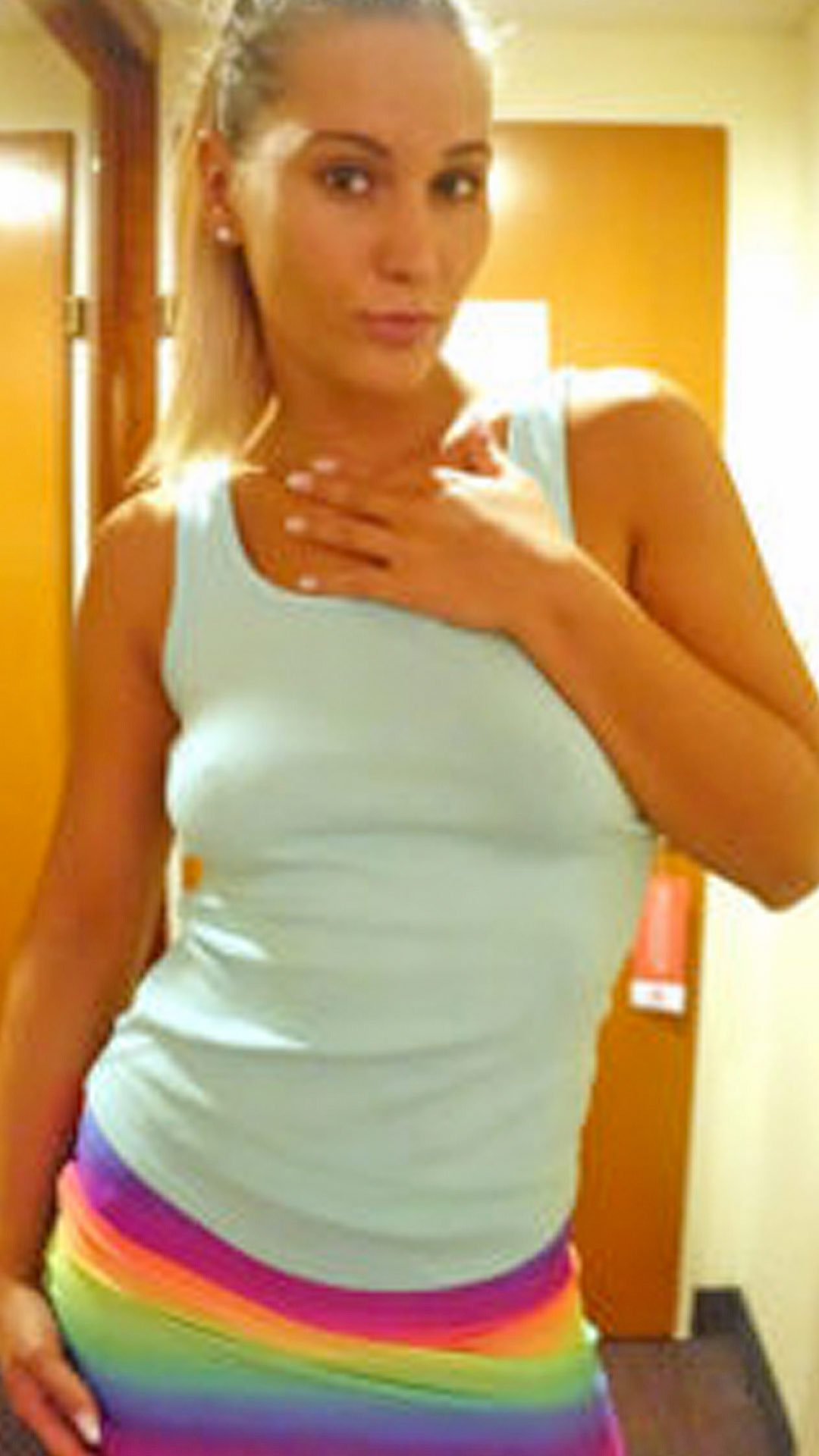 Blonde Asian Sex Diary Naomi Bennett standing in her nice clothes