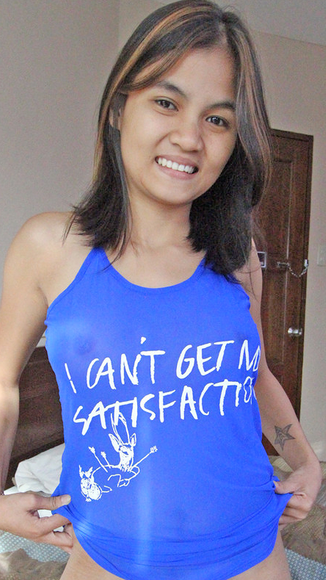 Excited Asian Sex Diary Mitch poses on her sexy blue top