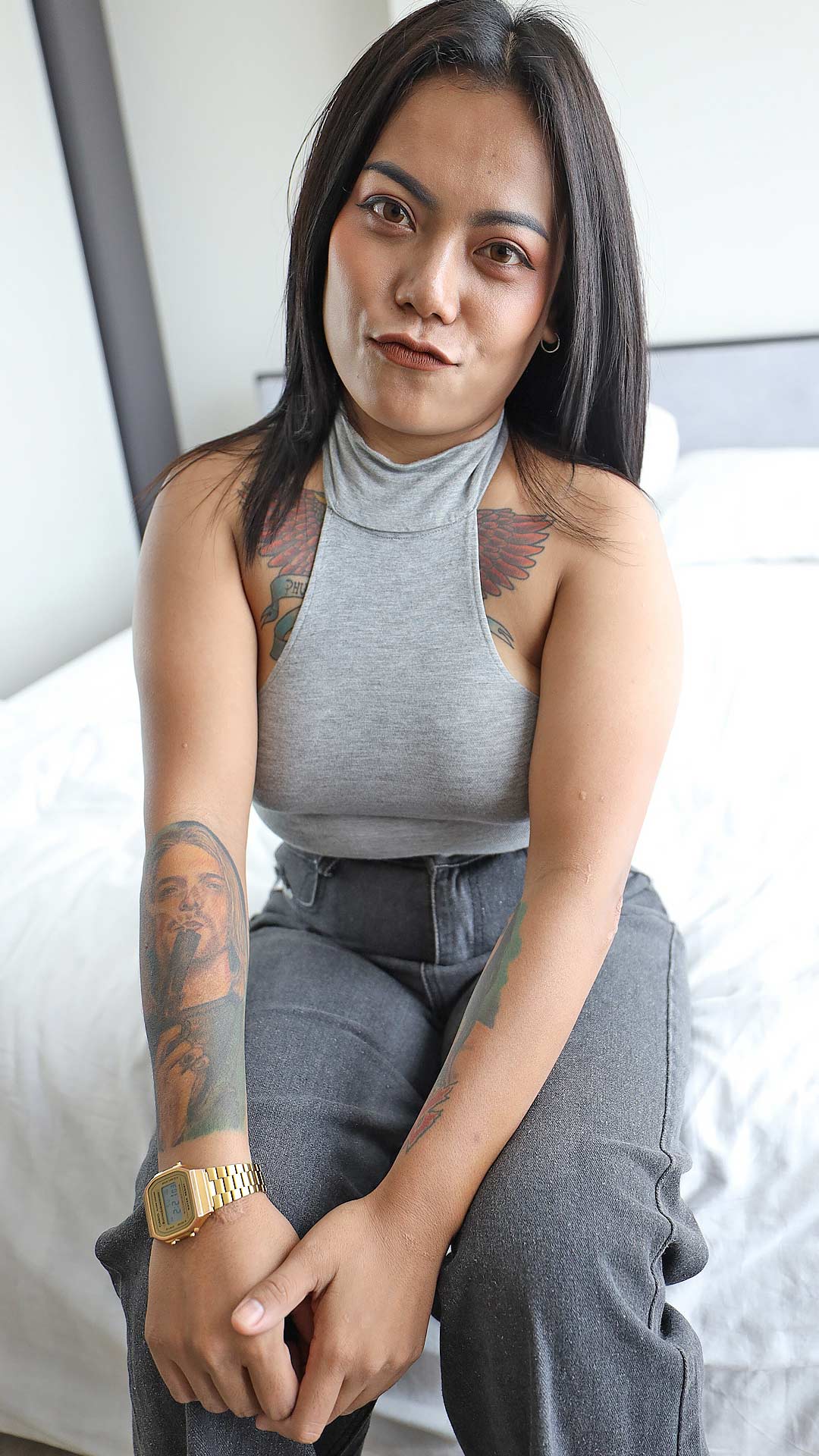 Inked up Asian Sex Diary Mink B sits in her pants and sexy top
