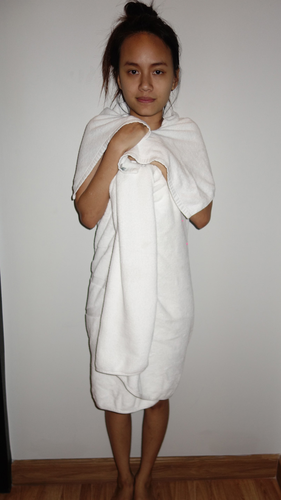 Asian Sex Diary Gin poses with a wrapped towel on her body