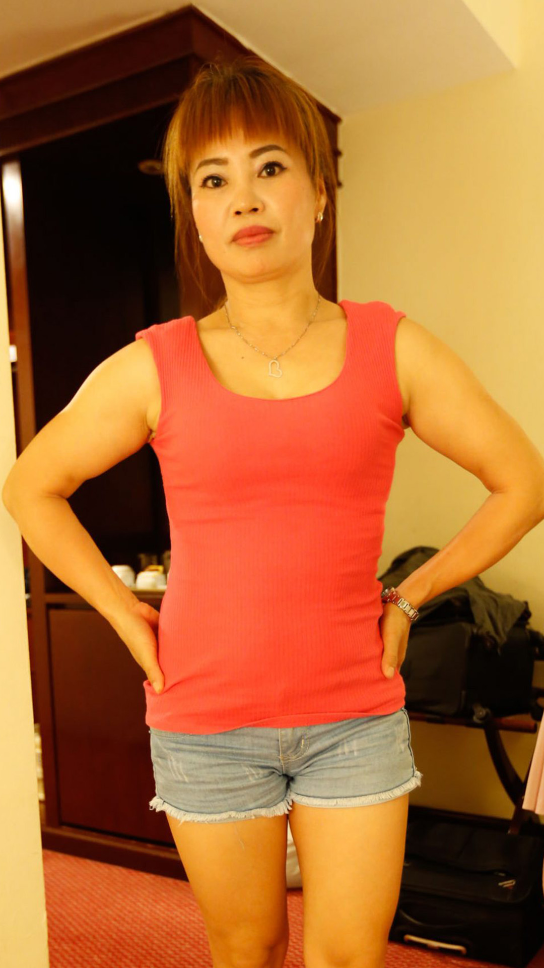 Asian Sex Diary Hong Xin poses for camera in room