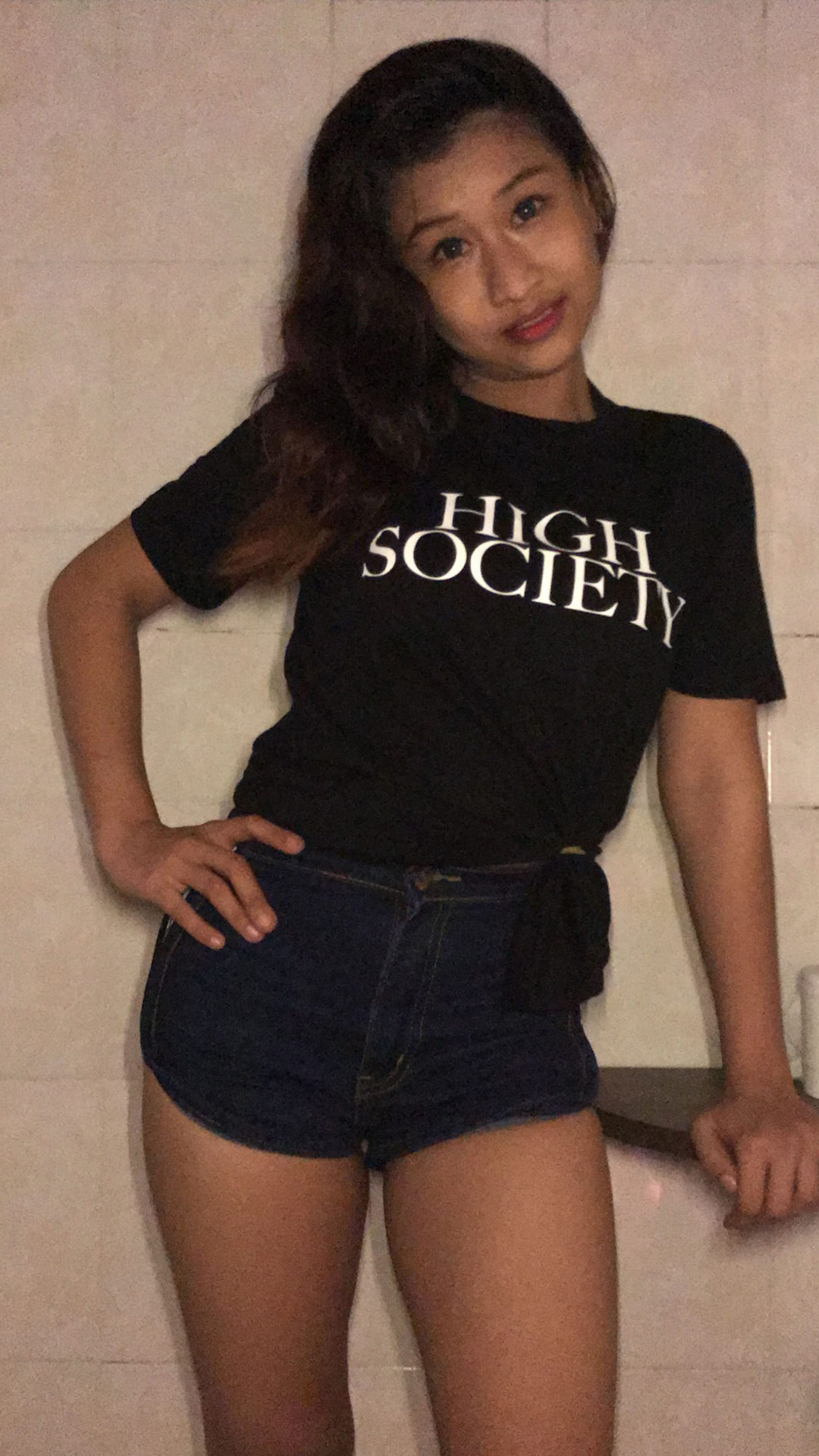 Asian Sex Diary Irene poses for camera with her company shirt on