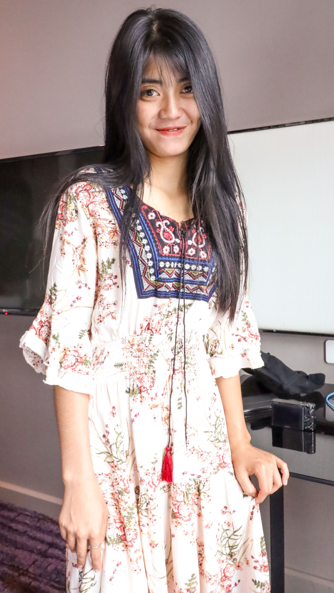 Asian Sex Diary Wanda smiling happy to be modeling fully clothed