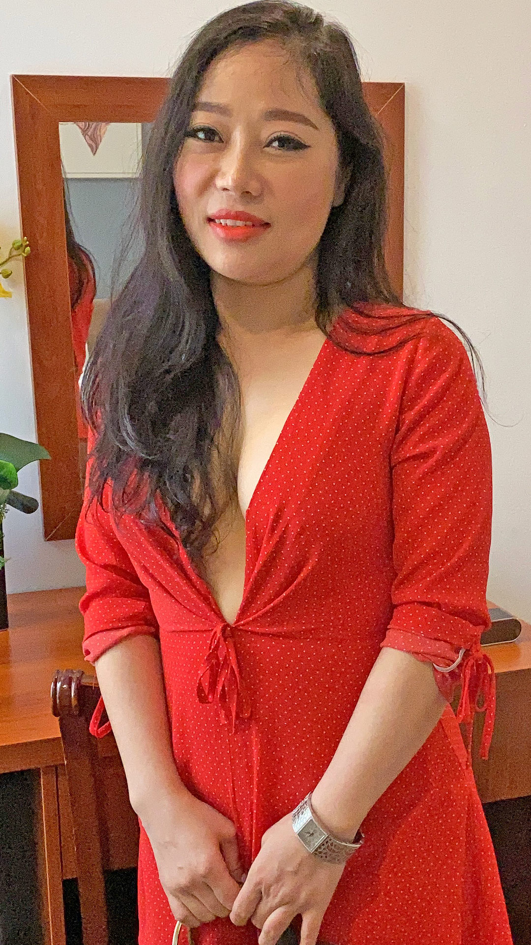 Horny Asian Sex Diary Pat D poses in her red top with no bra
