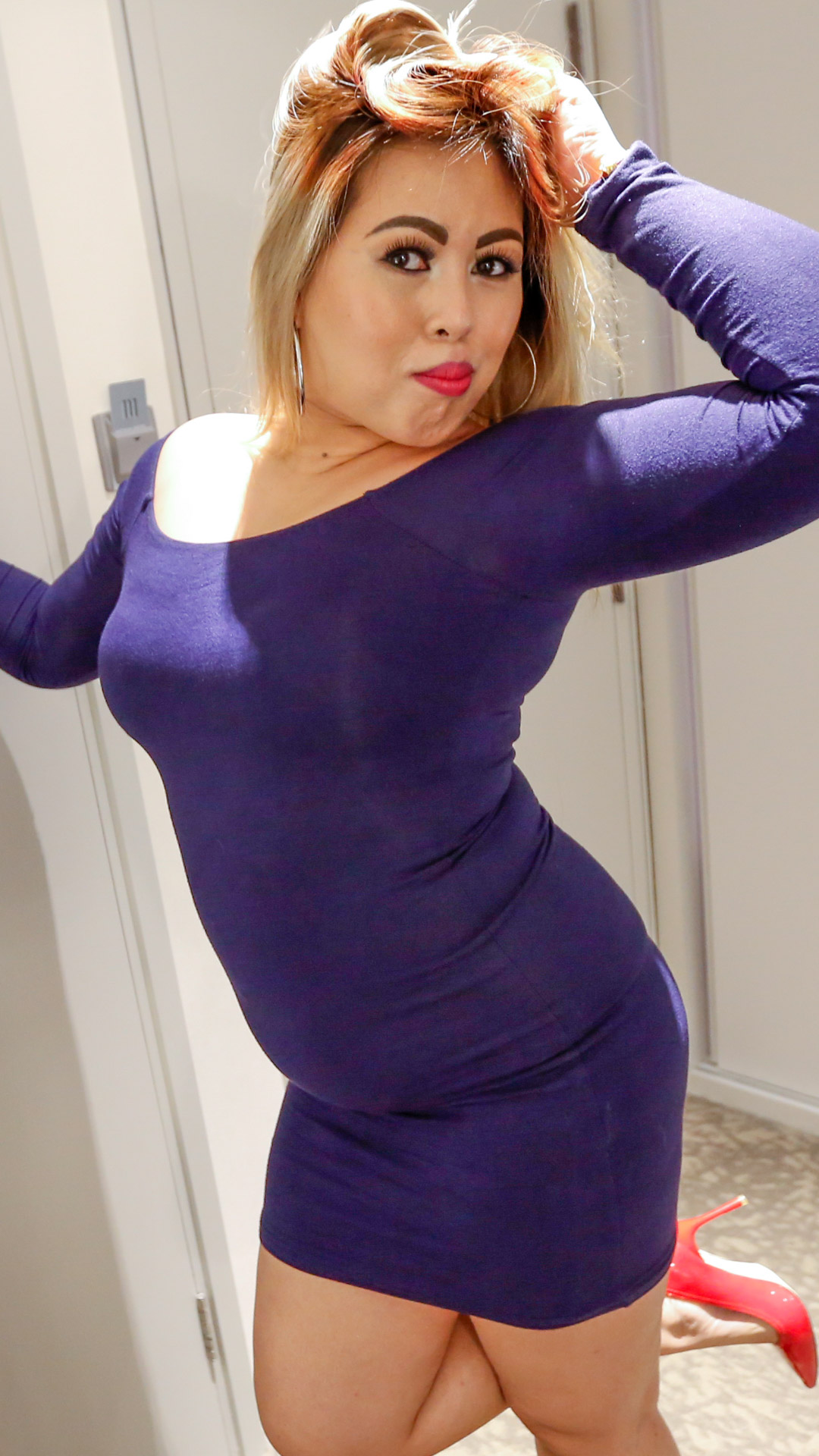 Shapely Asian Sex Diary Shelly models her thick body wearing a tight blue dress