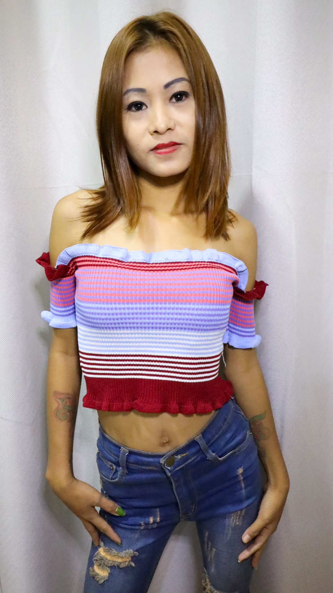 Petite and slender Asian Sex Diary Susi B models in tight jean and stripped top