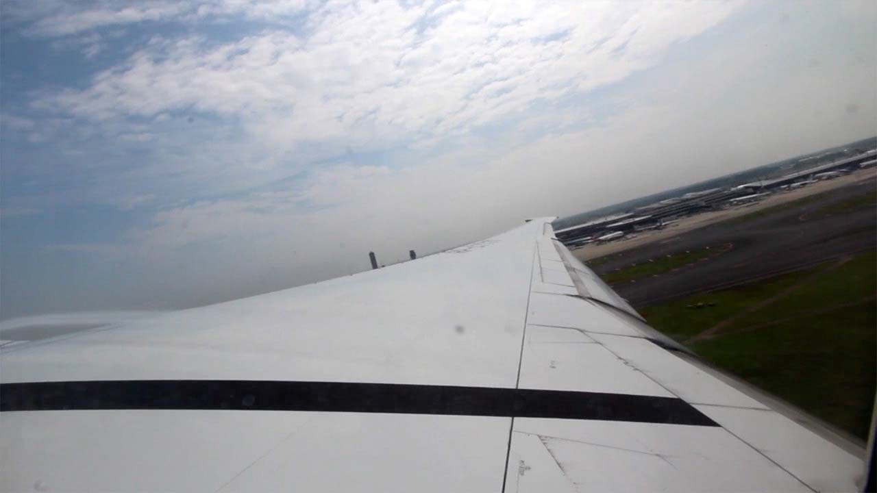View of plane wing on flight from Tokyo To Bangkok