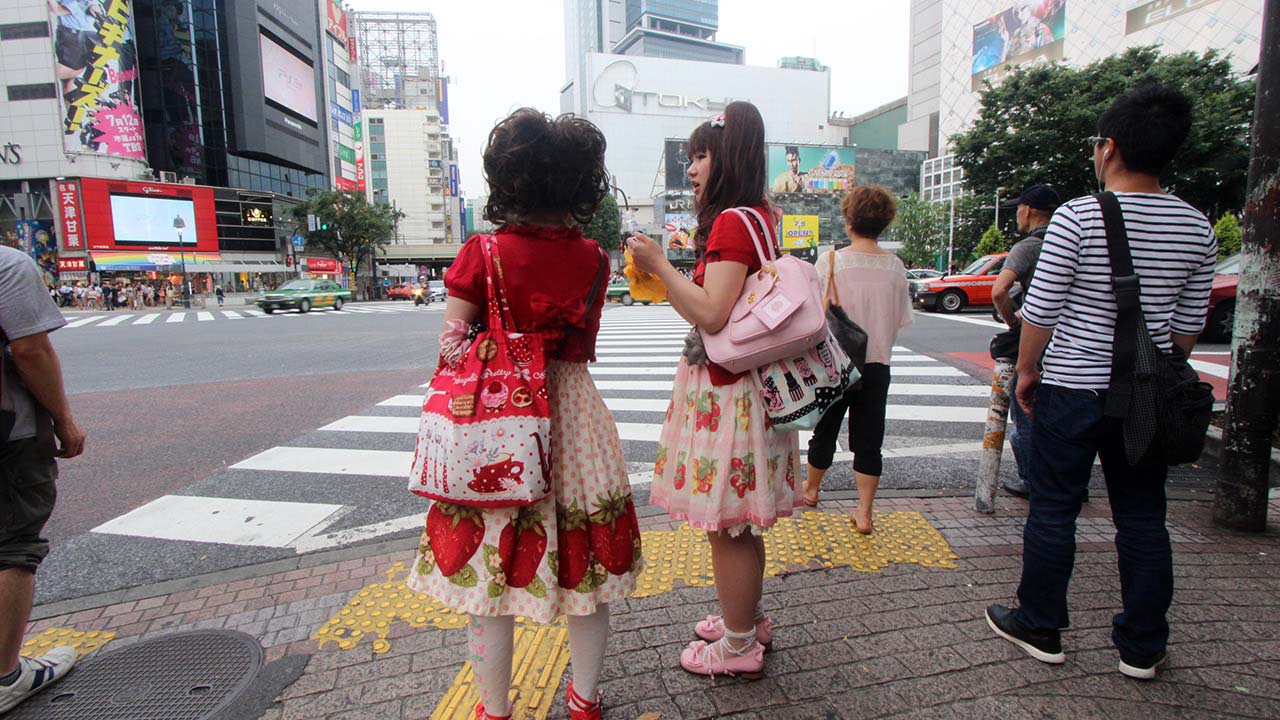 Japanese Girls standing at crosswalk in Shibuya City