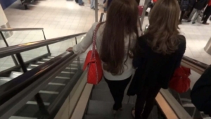 Girls walking down stairs at airport on my Amsterdam Arrival
