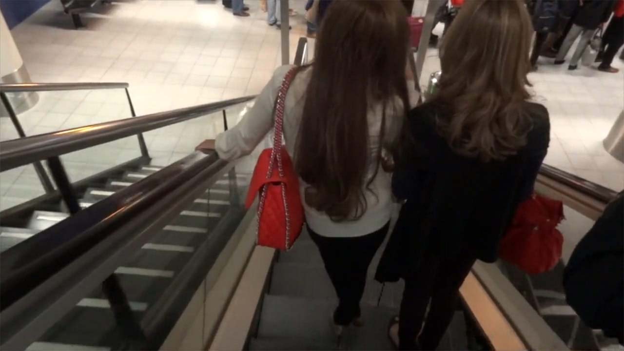 Girls walking down stairs at airport on my Amsterdam Arrival