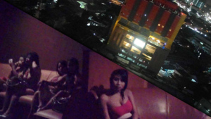 View from my my window and girls sitting around inside Hotel Travel Jakarta