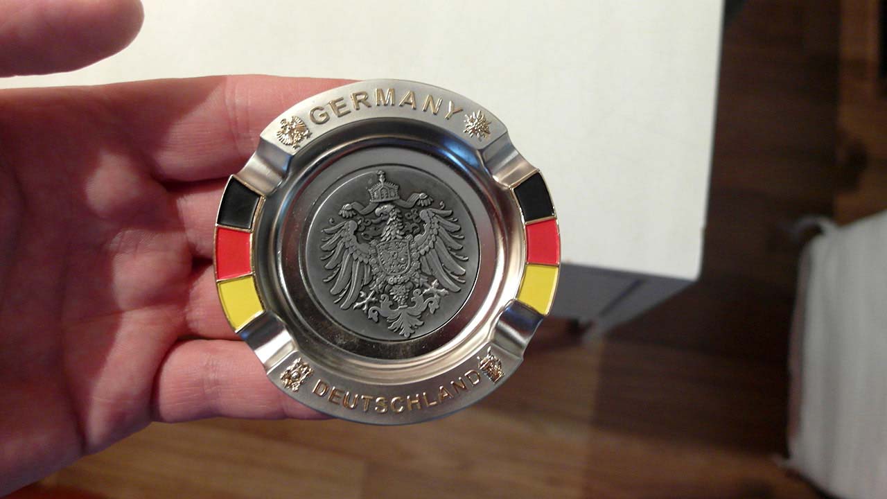 Holding medialion for camera after Driving To Koln