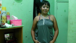 Indonesian MILF poses in green loose fitting top