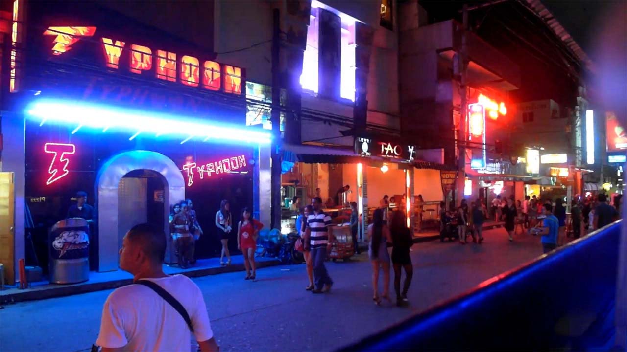 People walking on Fields Ave at night