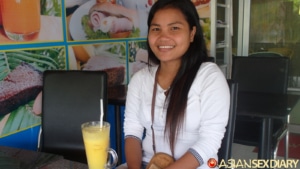 Sitting and smiling at beach side cafe