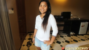 Posing with hand on hip in hotel room