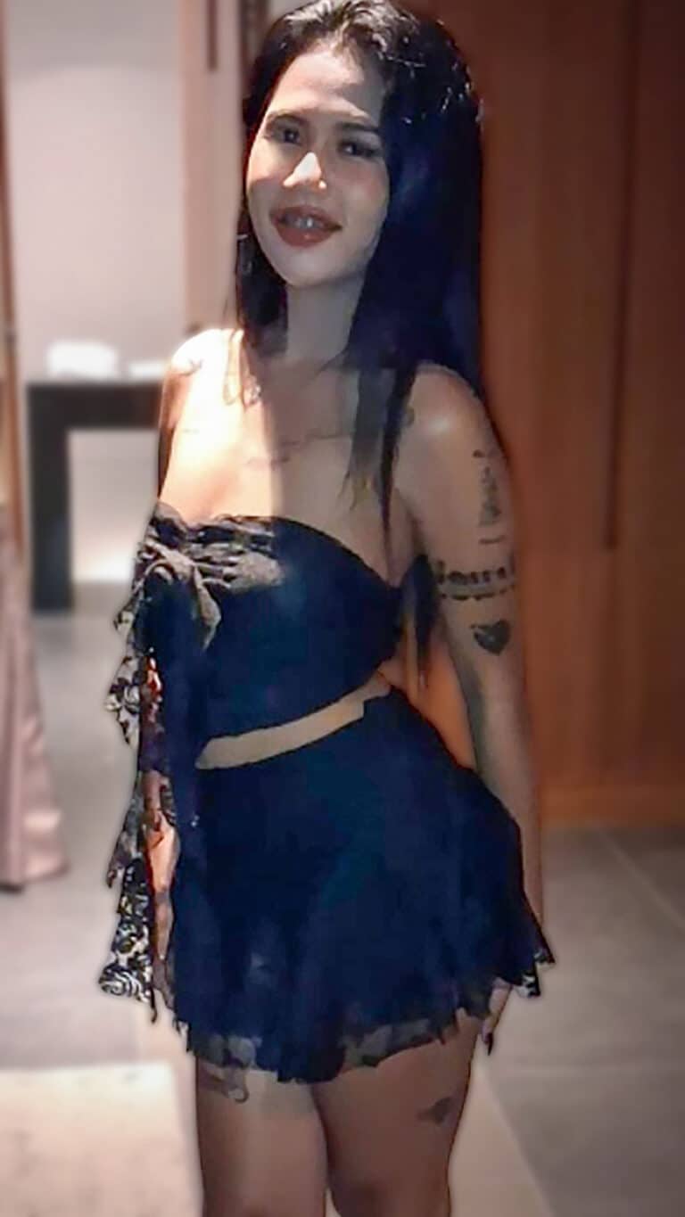 Tatted up Thai Katty poses in sexy outfit