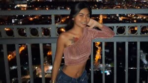 Leaning against balcony on high rise